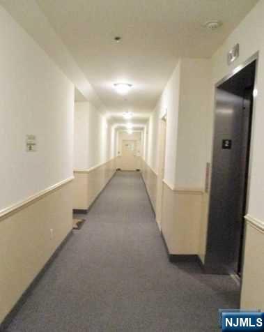 380-382 Anderson Avenue, Unit C1 Cliffside Park, NJ 07010 - Photo 6 of 17 a view of a hallway with staircase