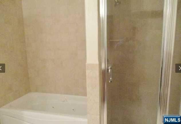 380-382 Anderson Avenue, Unit C1 Cliffside Park, NJ 07010 - Photo 9 of 17 a close up of a bathtub in a bathroom