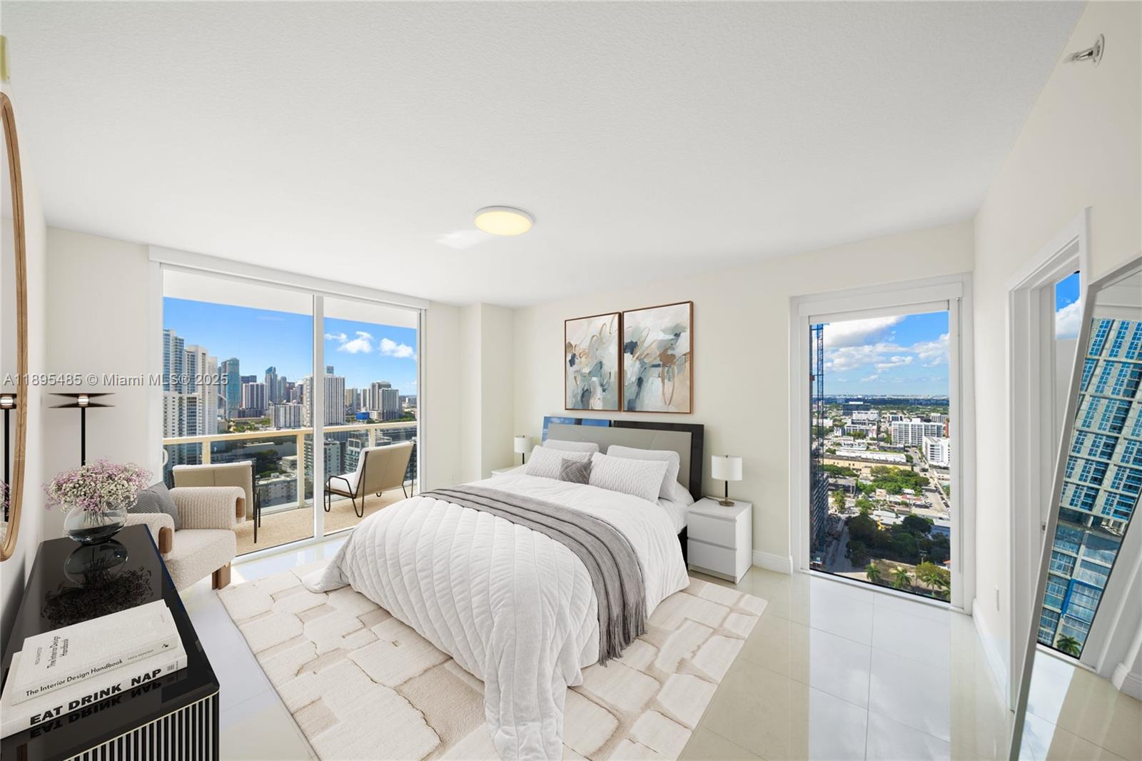 600 Northeast 27th Street, Unit 3105 Miami, FL 33137 - Photo 14 of 61 a bedroom with a large bed and a large window