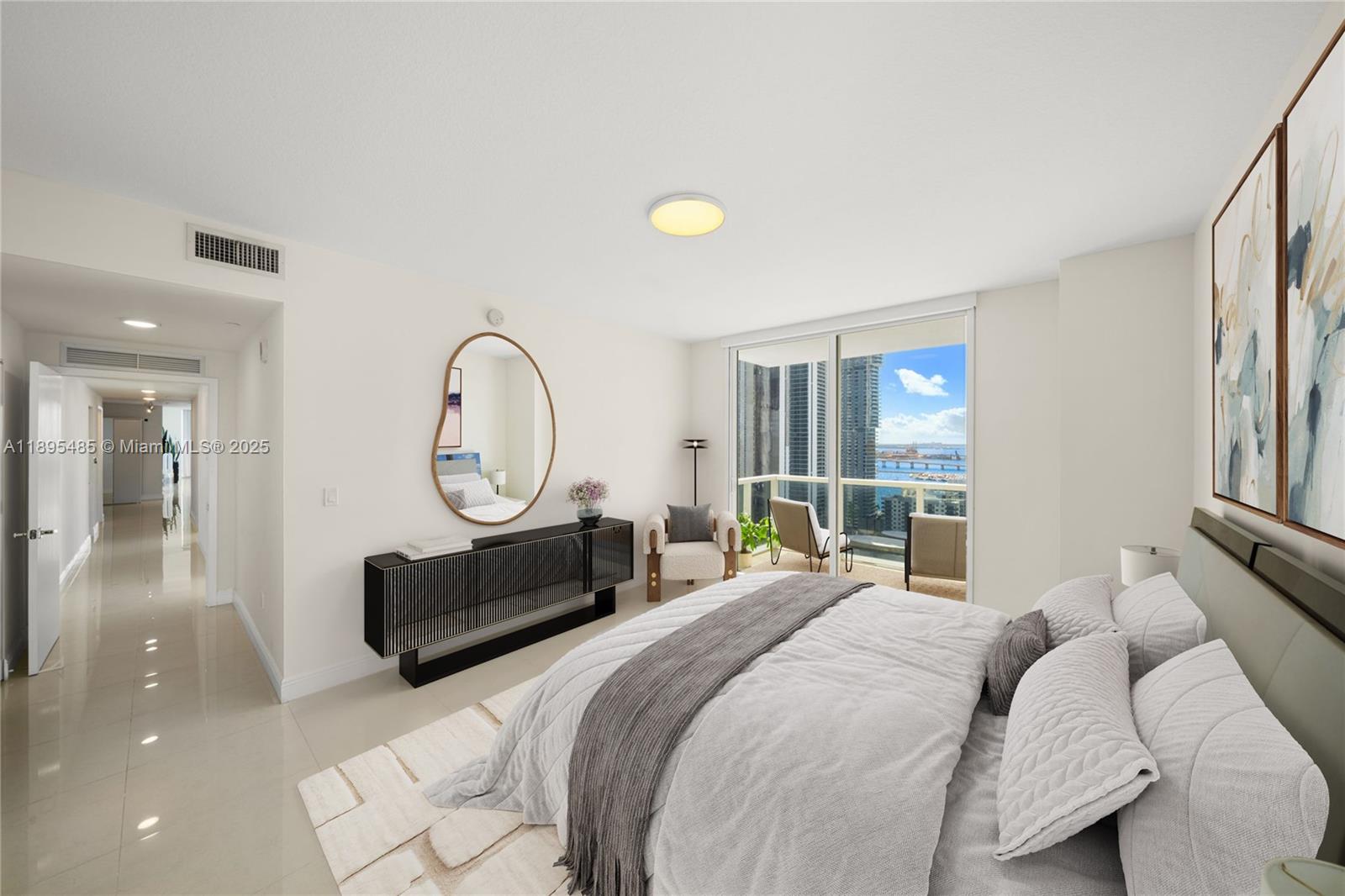 600 Northeast 27th Street, Unit 3105 Miami, FL 33137 - Photo 16 of 61 a bedroom with a bed mirror and a window