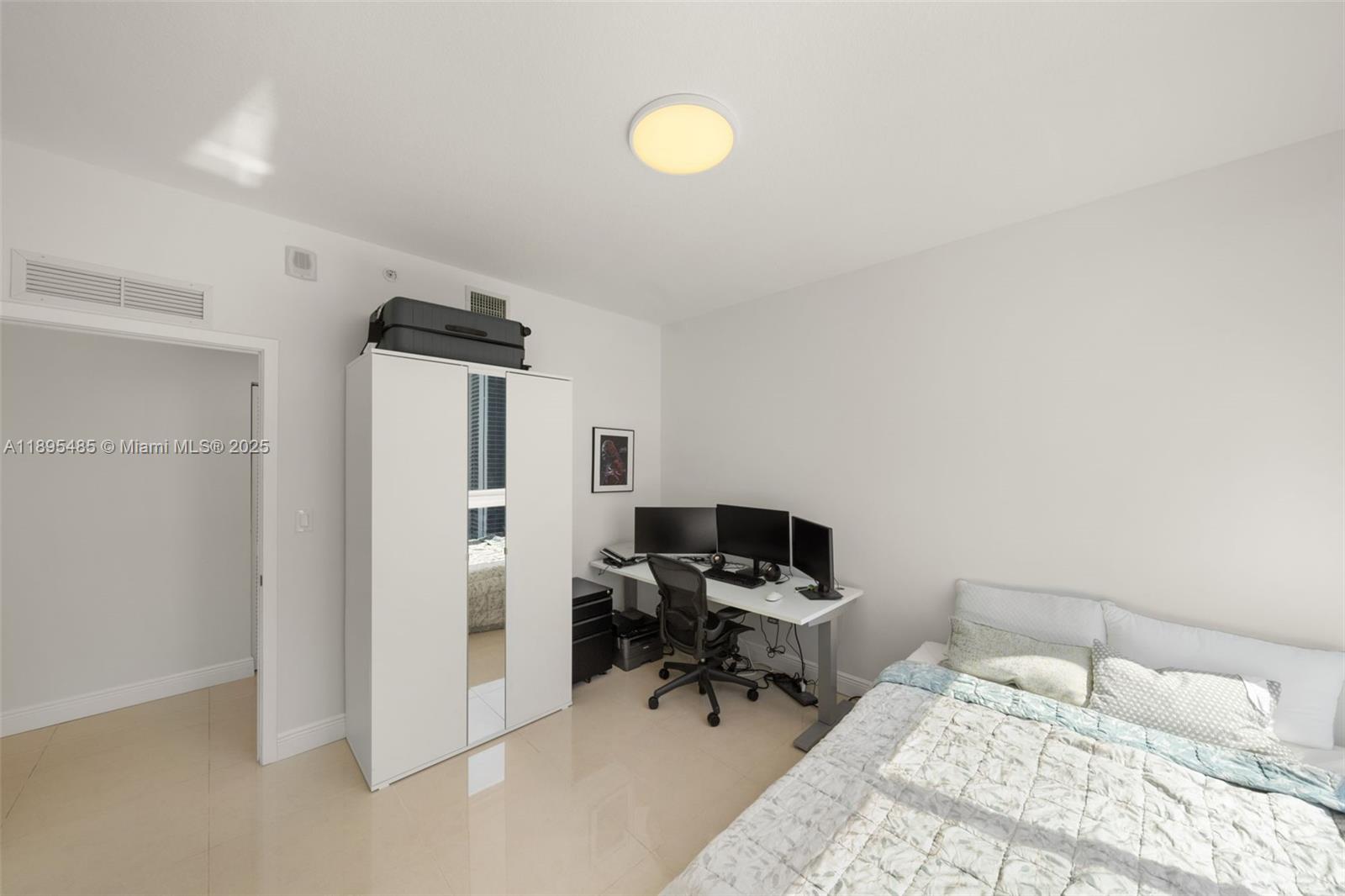 600 Northeast 27th Street, Unit 3105 Miami, FL 33137 - Photo 21 of 61 a bedroom with a bed and a desk