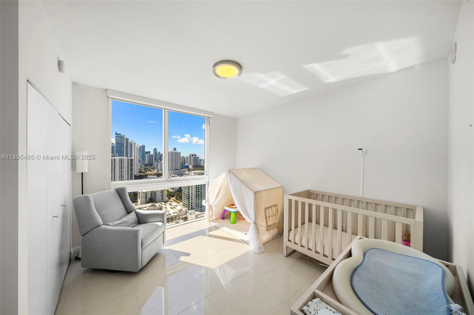 600 Northeast 27th Street, Unit 3105 Miami, FL 33137 - Photo 24 of 61 a living room with furniture and a window