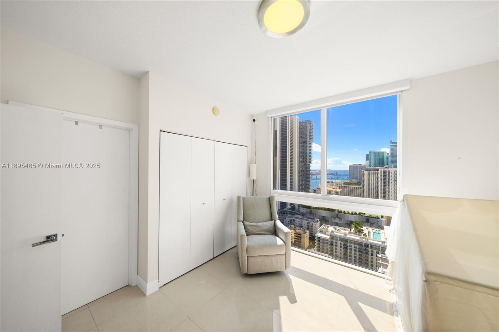 600 Northeast 27th Street, Unit 3105 Miami, FL 33137 - Photo 25 of 61 a kitchen with stainless steel appliances a refrigerator and cabinets
