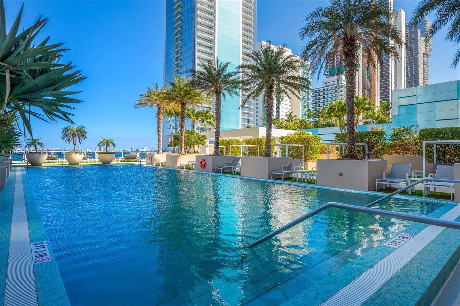 600 Northeast 27th Street, Unit 3105 Miami, FL 33137 - Photo 46 of 61 a view of a swimming pool and a longer chairs