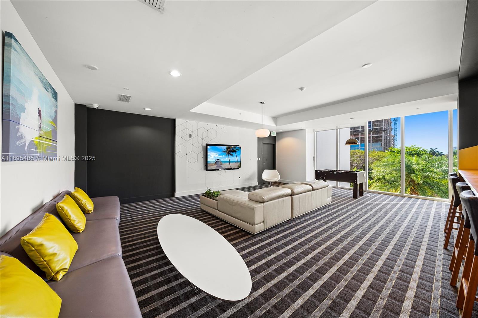 600 Northeast 27th Street, Unit 3105 Miami, FL 33137 - Photo 56 of 61 a living room with furniture a rug and a flat screen tv