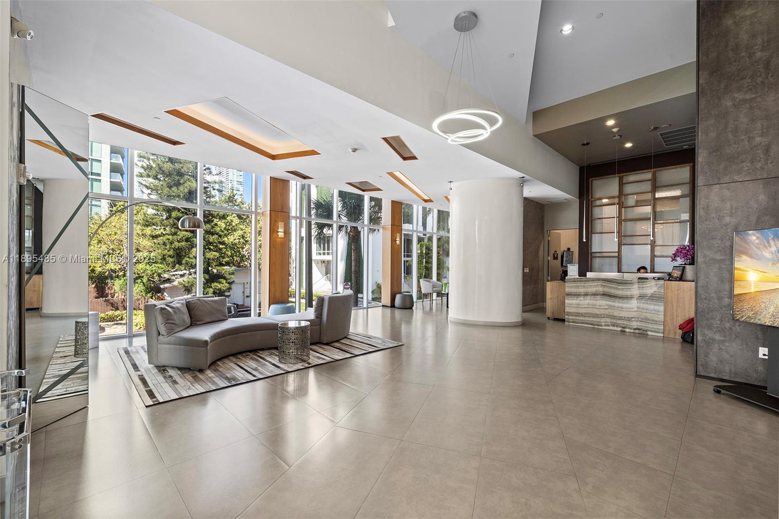 600 Northeast 27th Street, Unit 3105 Miami, FL 33137 - Photo 57 of 61 a living room with furniture and large windows