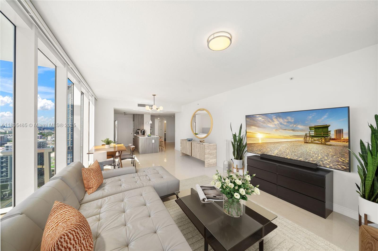 600 Northeast 27th Street, Unit 3105 Miami, FL 33137 - Photo 8 of 61 a living room with furniture and a flat screen tv