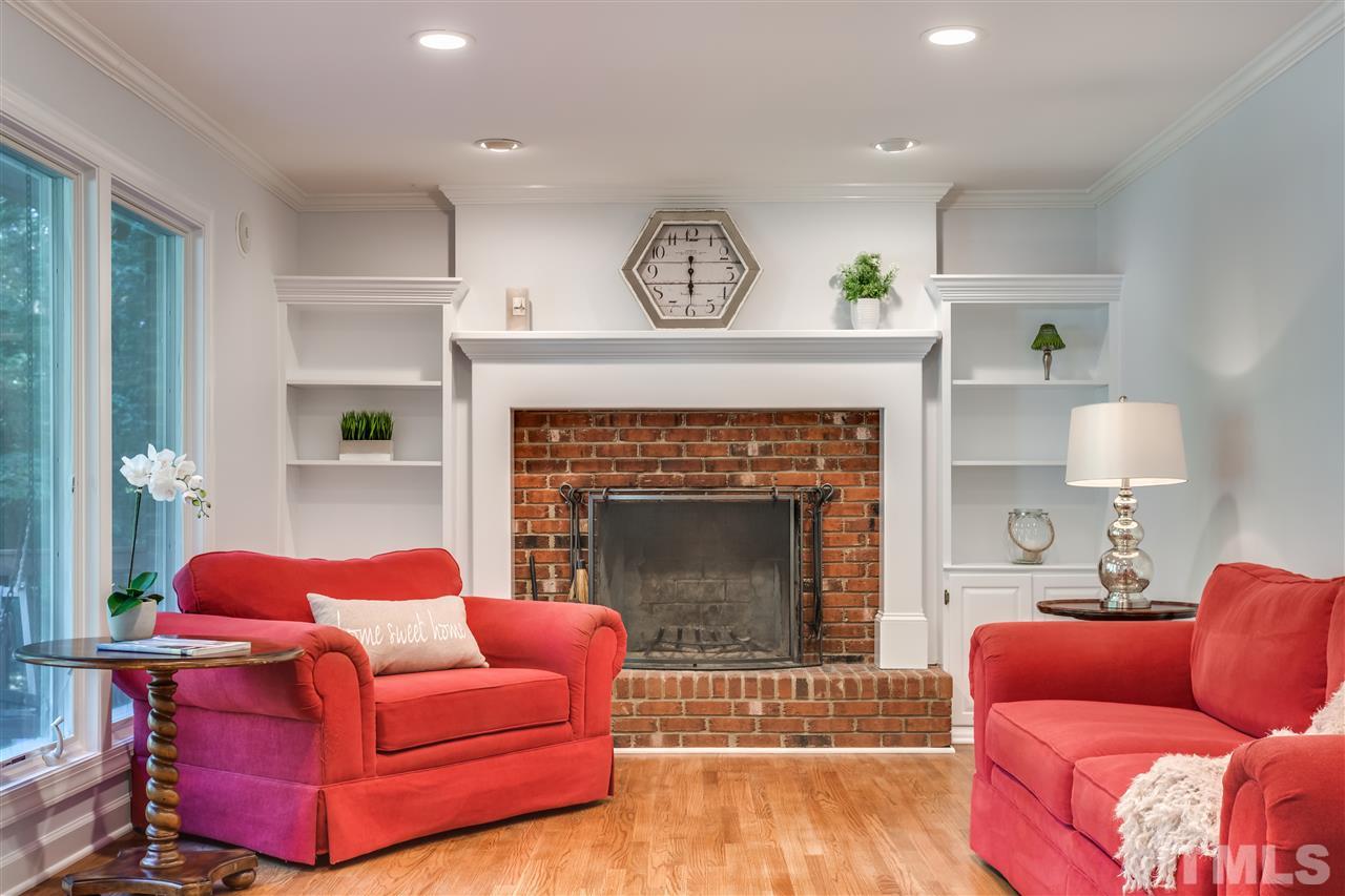 8713 Cliff Top Court Raleigh, NC 27613 - Photo 11 of 25 a living room with furniture and a fireplace