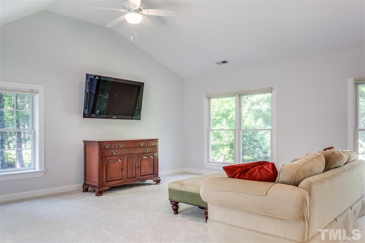 8713 Cliff Top Court Raleigh, NC 27613 - Photo 14 of 25 a living room with furniture and a flat screen tv