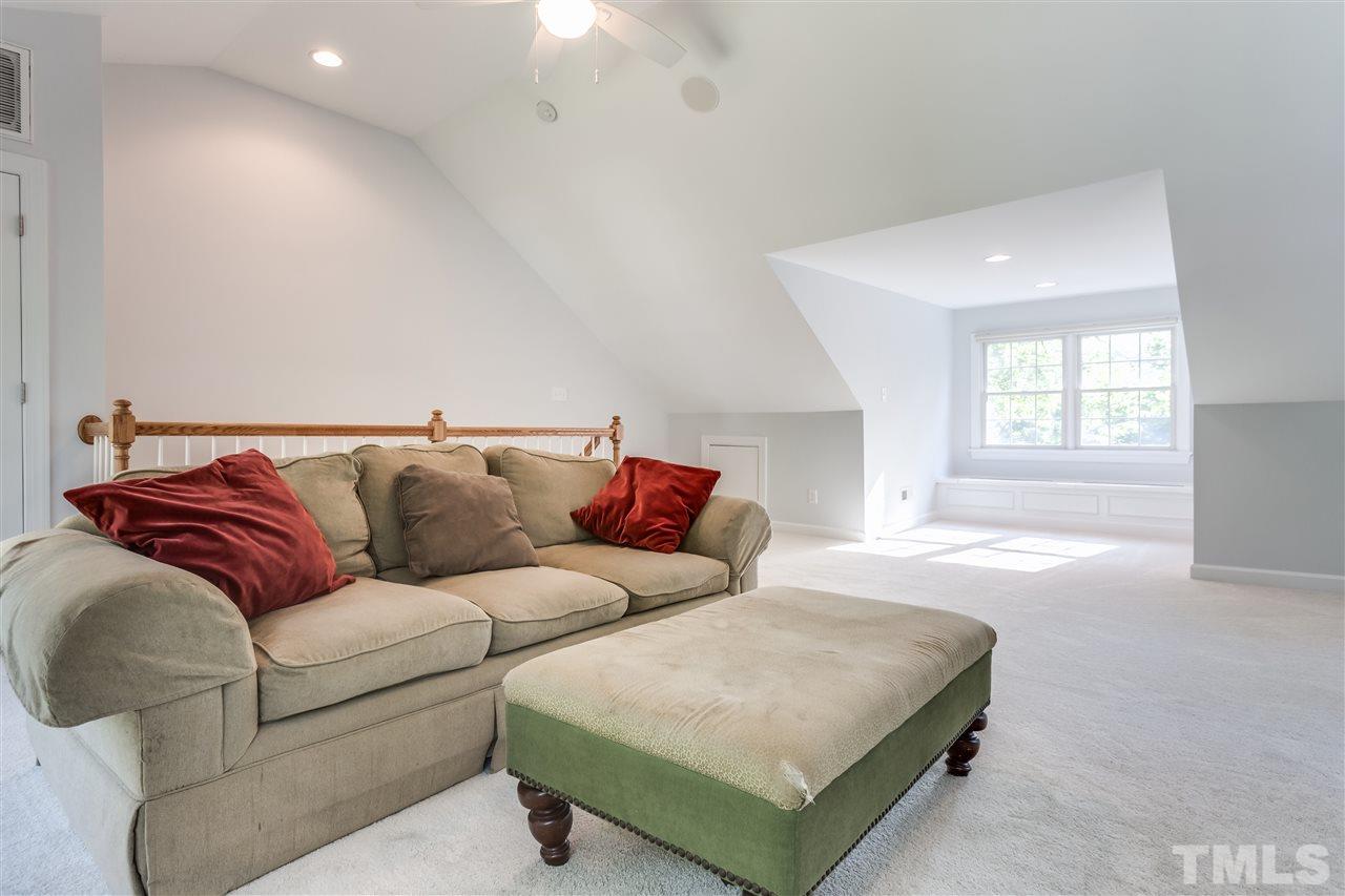 8713 Cliff Top Court Raleigh, NC 27613 - Photo 15 of 25 a living room with a couch and window
