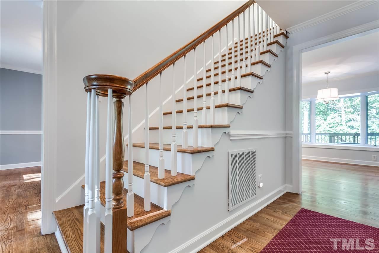 8713 Cliff Top Court Raleigh, NC 27613 - Photo 3 of 25 a view of entryway with wooden floor