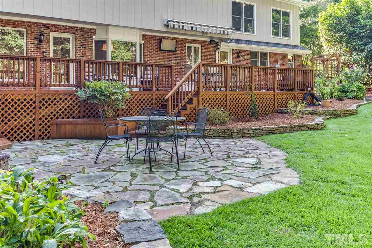 8713 Cliff Top Court Raleigh, NC 27613 - Photo 22 of 25 a view of a house with backyard and sitting area