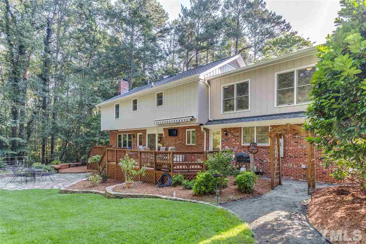 8713 Cliff Top Court Raleigh, NC 27613 - Photo 23 of 25 a view of a house with a yard and sitting area