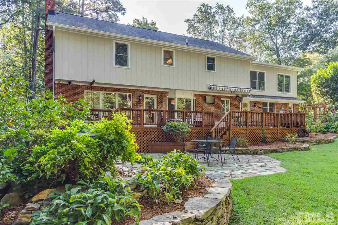 8713 Cliff Top Court Raleigh, NC 27613 - Photo 25 of 25 a front view of a house with garden