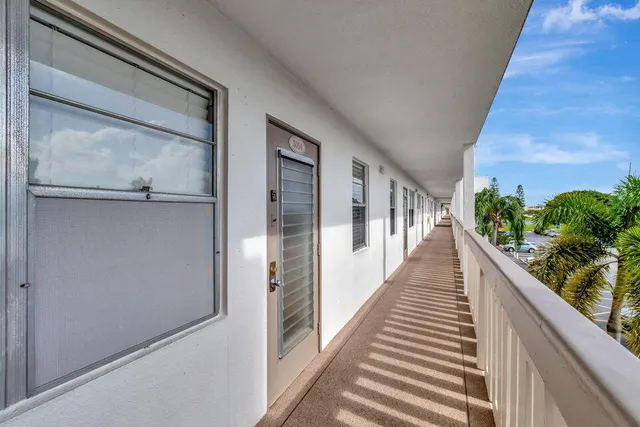 a view of a balcony with wooden floor