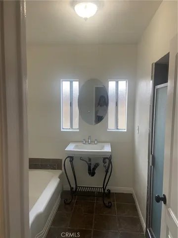a bathroom with a sink and a bathtub