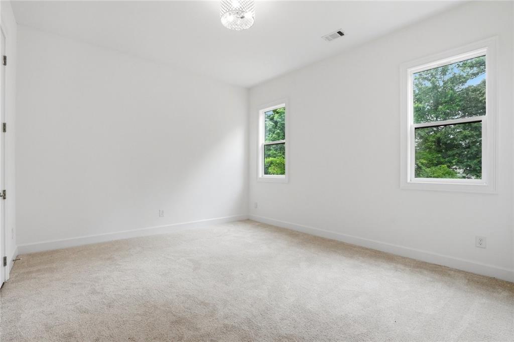 2415 West Rugby Avenue Atlanta, GA 30337 - Photo 21 of 40 an empty room with windows