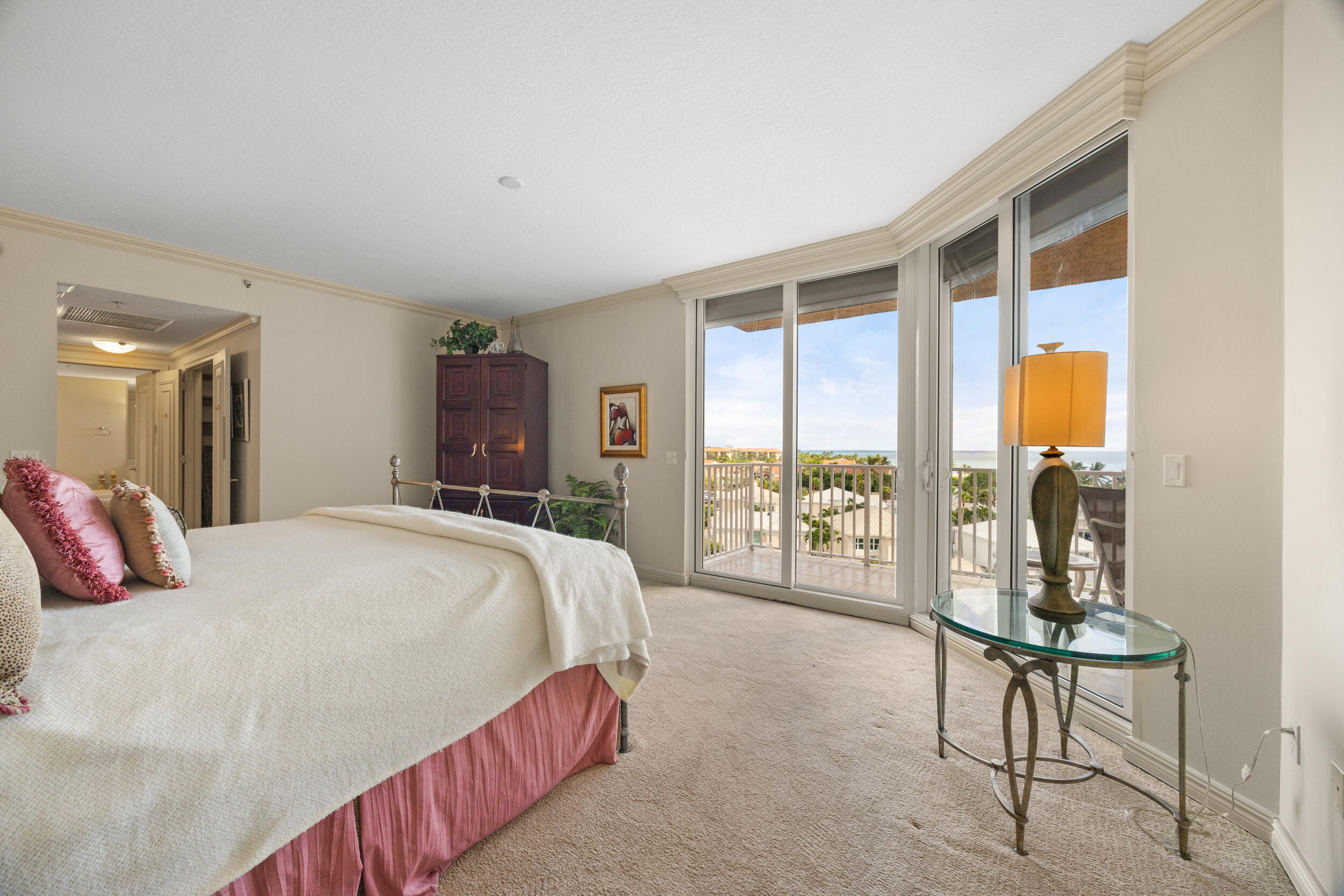 700 Ocean Royale, Unit 601 Juno Beach, FL 33408 - Photo 21 of 56 a bedroom with a large bed and a window