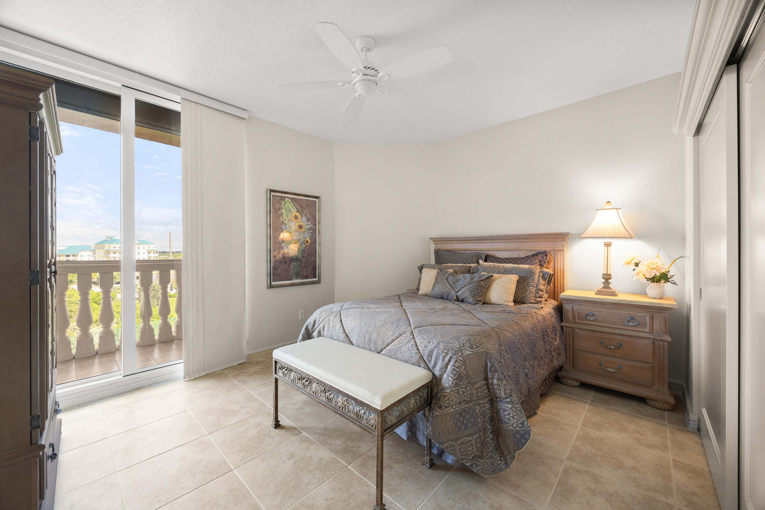 700 Ocean Royale, Unit 601 Juno Beach, FL 33408 - Photo 29 of 56 a bedroom with a bed and large window