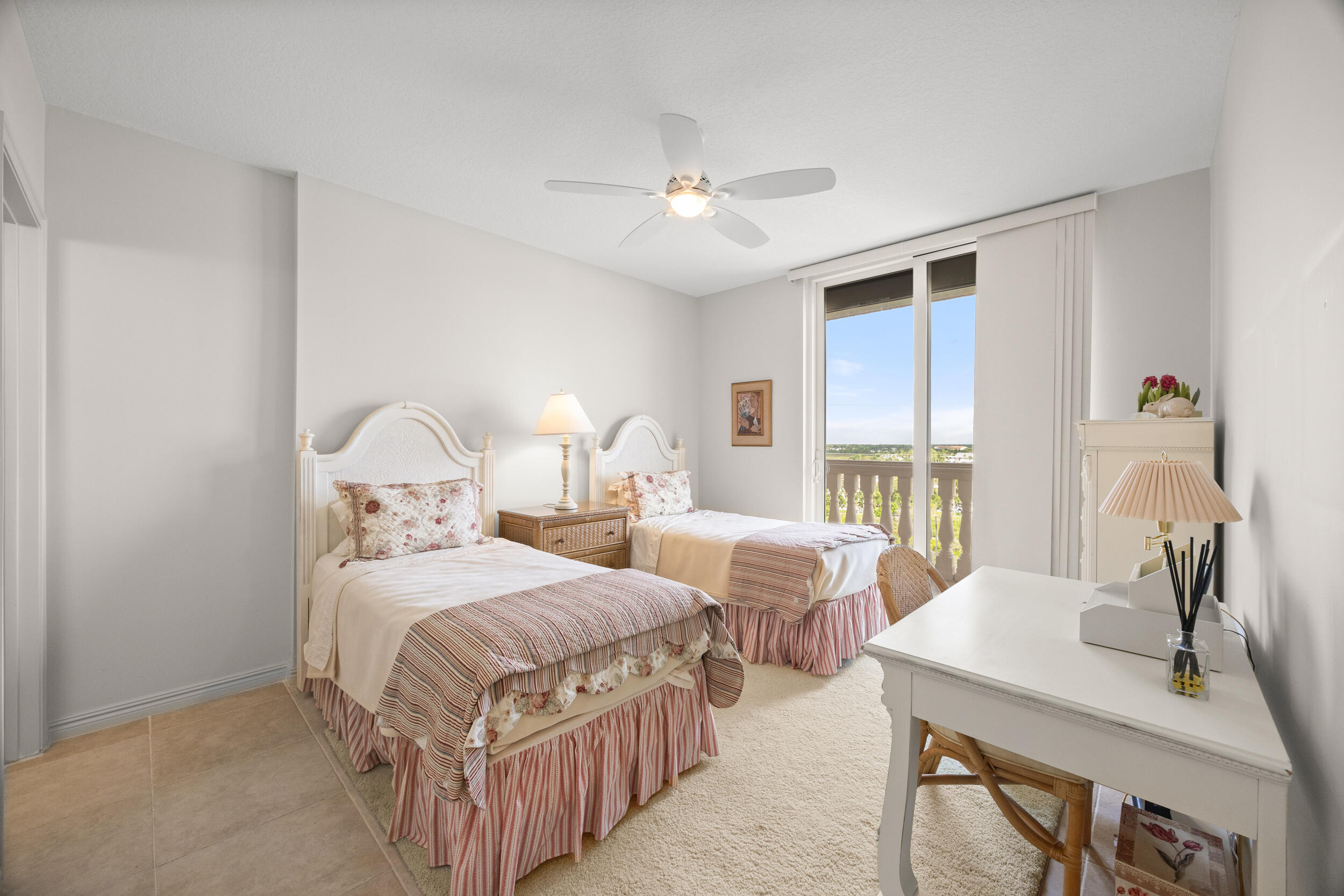700 Ocean Royale, Unit 601 Juno Beach, FL 33408 - Photo 34 of 56 a bedroom with two beds and a large window