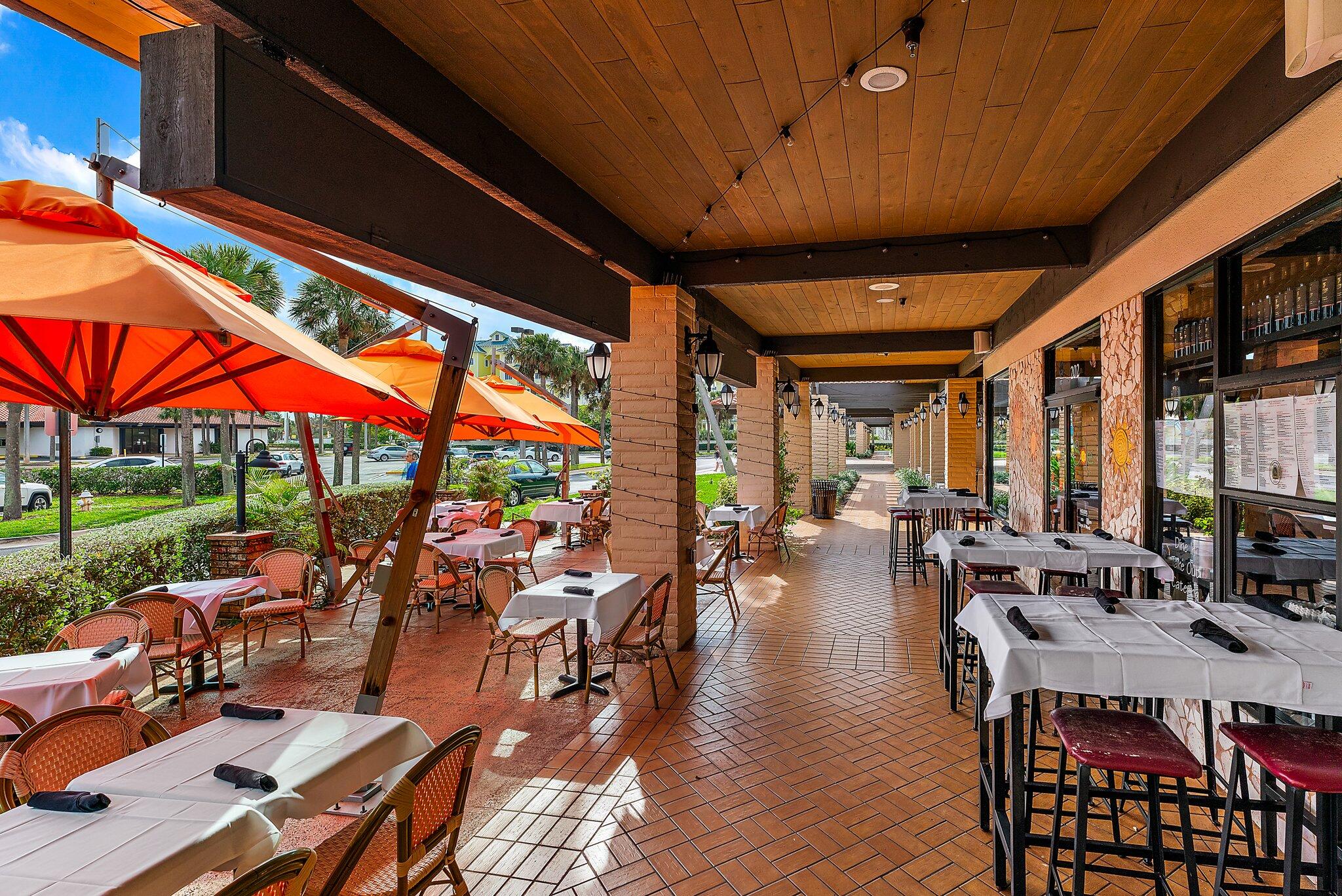 700 Ocean Royale, Unit 601 Juno Beach, FL 33408 - Photo 55 of 56 a outdoor space with lots of furniture and outdoor seating