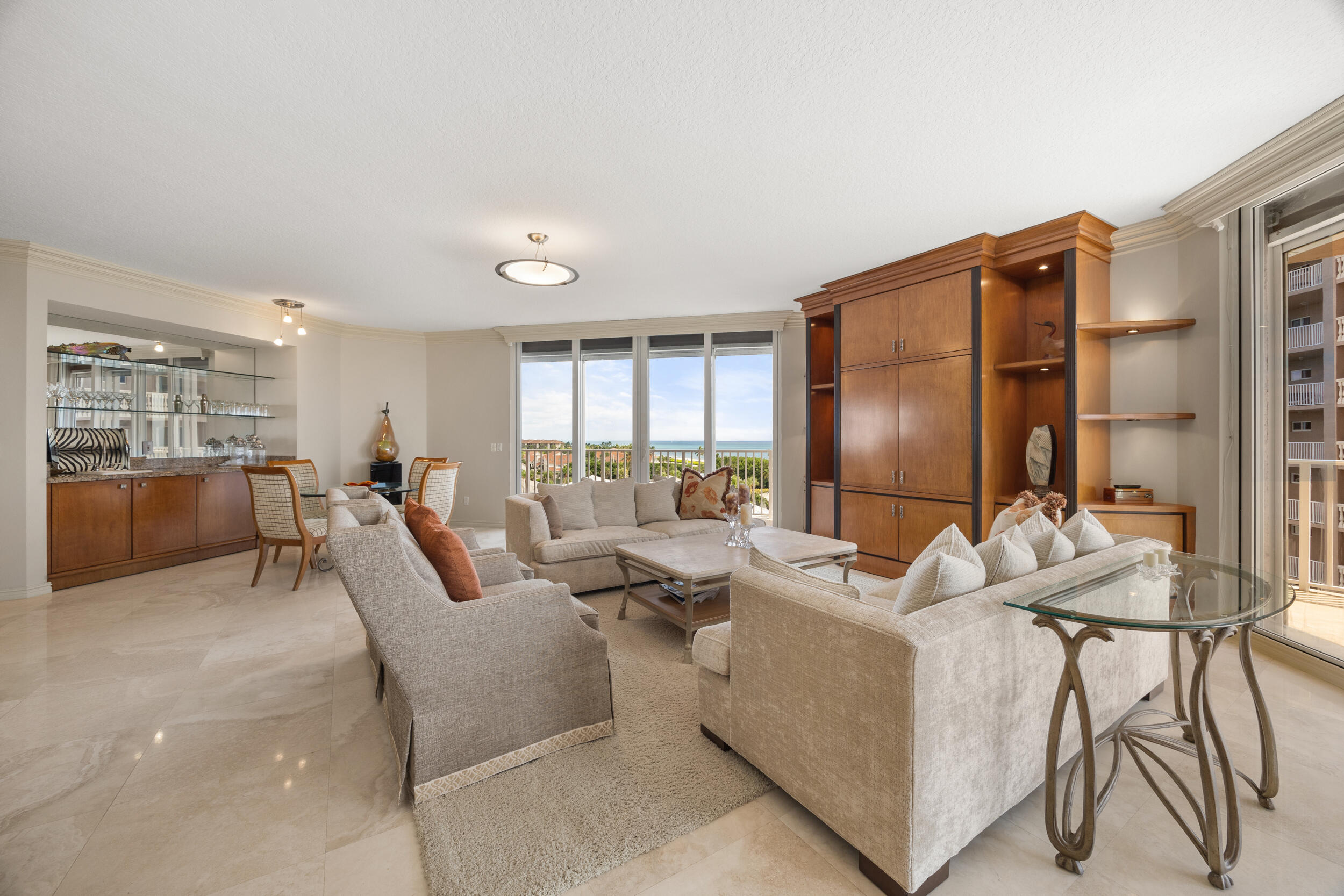 700 Ocean Royale, Unit 601 Juno Beach, FL 33408 - Photo 9 of 56 a living room with furniture and a window