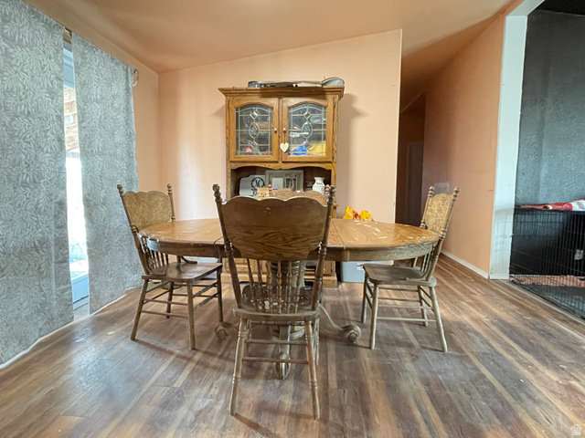 240 Horseshoe Bend Road Vernal, UT 84078 - Photo 10 of 41 Dining space with wood-type flooring and lofted ceiling
