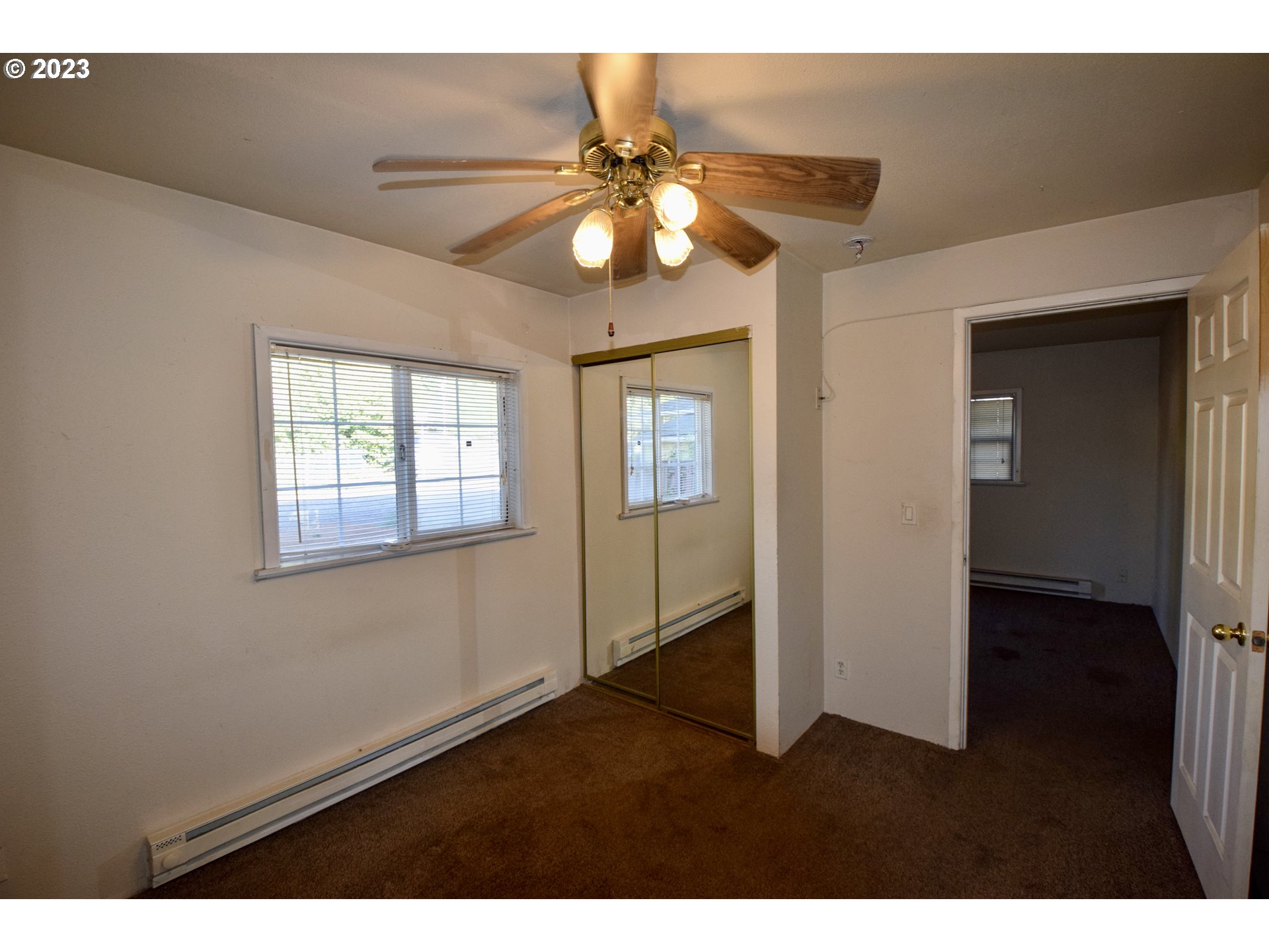 304 Southeast Boulevard Way Estacada, OR 97023 - Photo 11 of 15 a view interior of a house with a chandelier fan and windows