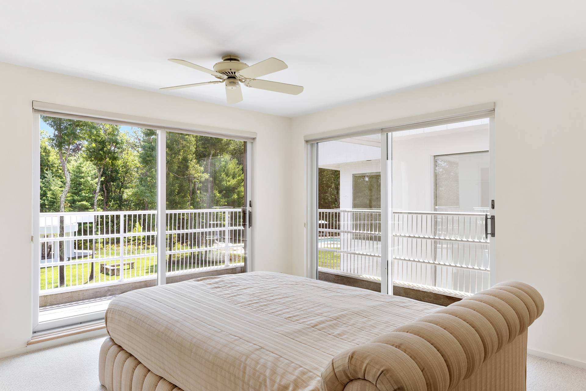 147 Old Northwest Road East Hampton, NY 11937 - Photo 20 of 45 a bedroom with a bed and a large window