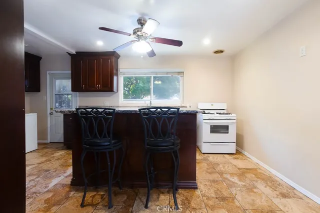 a kitchen with a sink cabinets and window