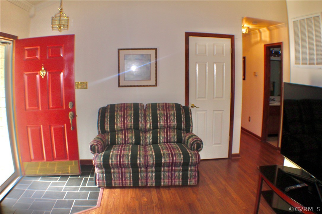 12100 Quito Road Midlothian, VA 23112 - Photo 3 of 33 a view of a bedroom with furniture and wooden floor