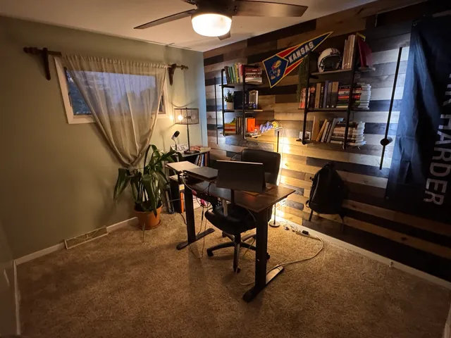 a reading room with furniture and a piano