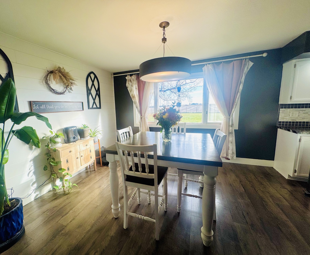 12944 Ospur Road Clinton, IL 61727 - Photo 4 of 21 a view of a dining room with furniture window and wooden floor