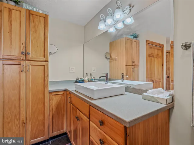 a kitchen with a sink and a refrigerator