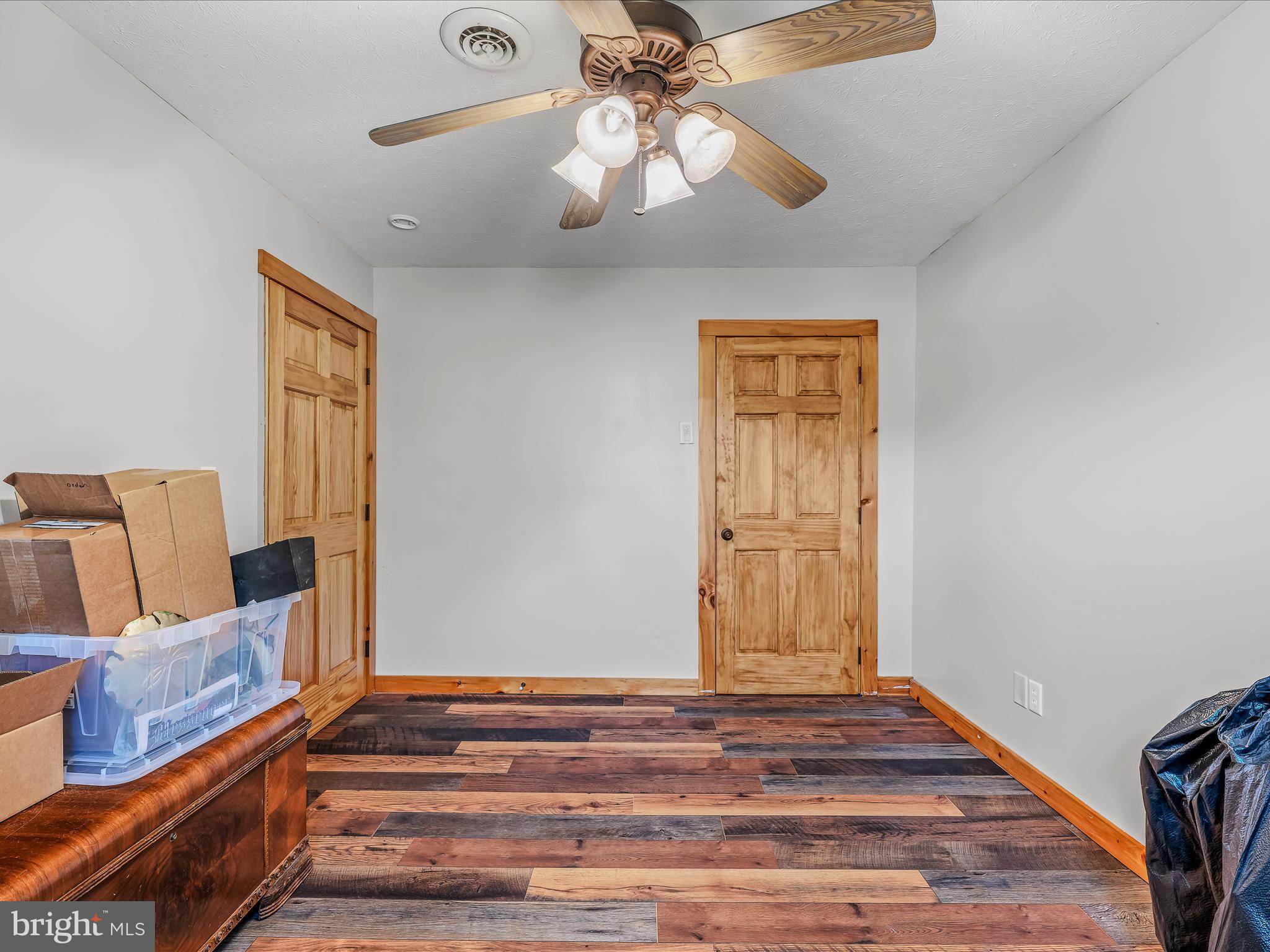 104 Golden Lane Berkeley Springs, WV 25411 - Photo 27 of 53 a bedroom with a bed and wooden floor