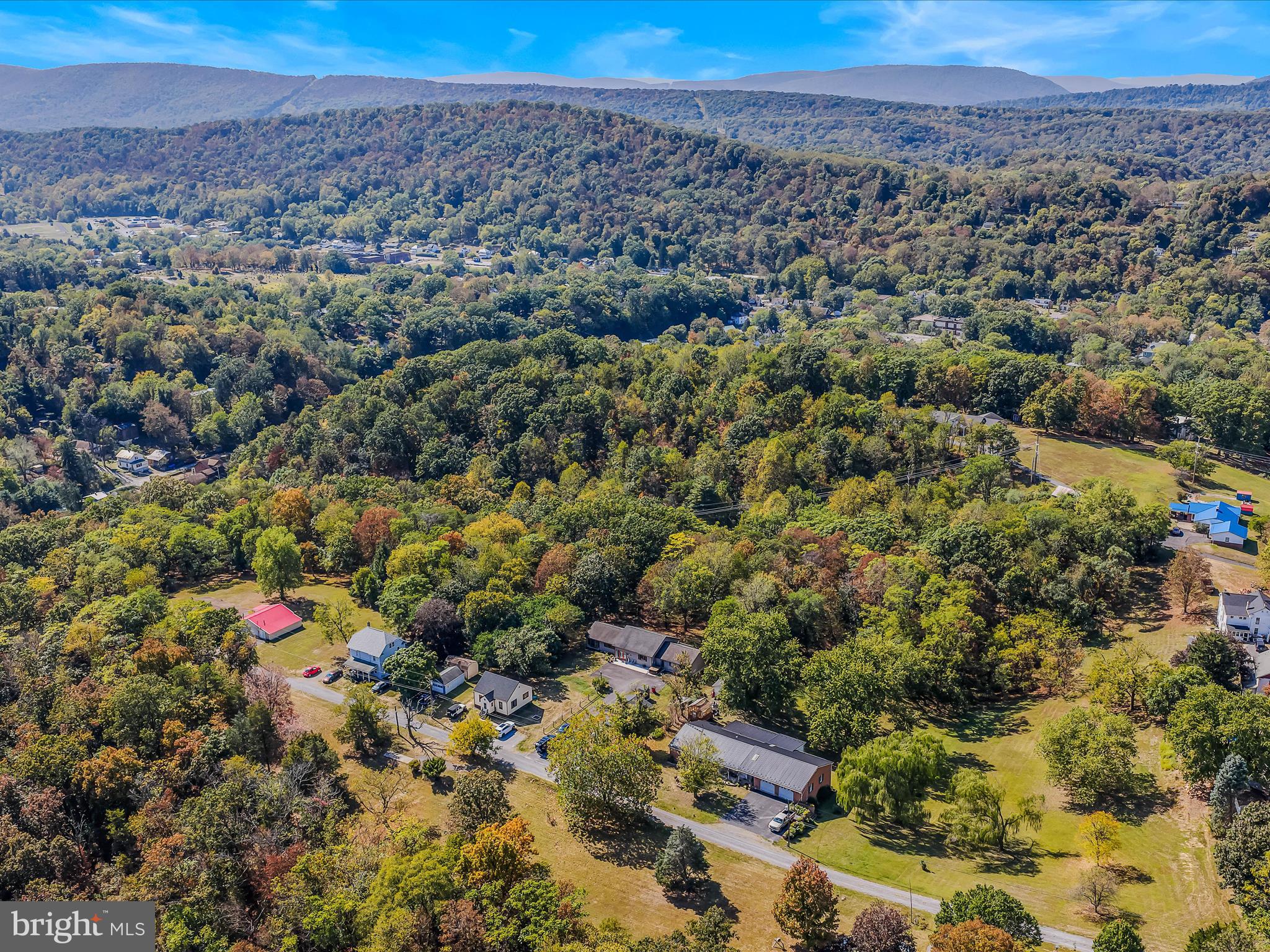 104 Golden Lane Berkeley Springs, WV 25411 - Photo 47 of 53 an aerial view of a houses with a lush green hillside