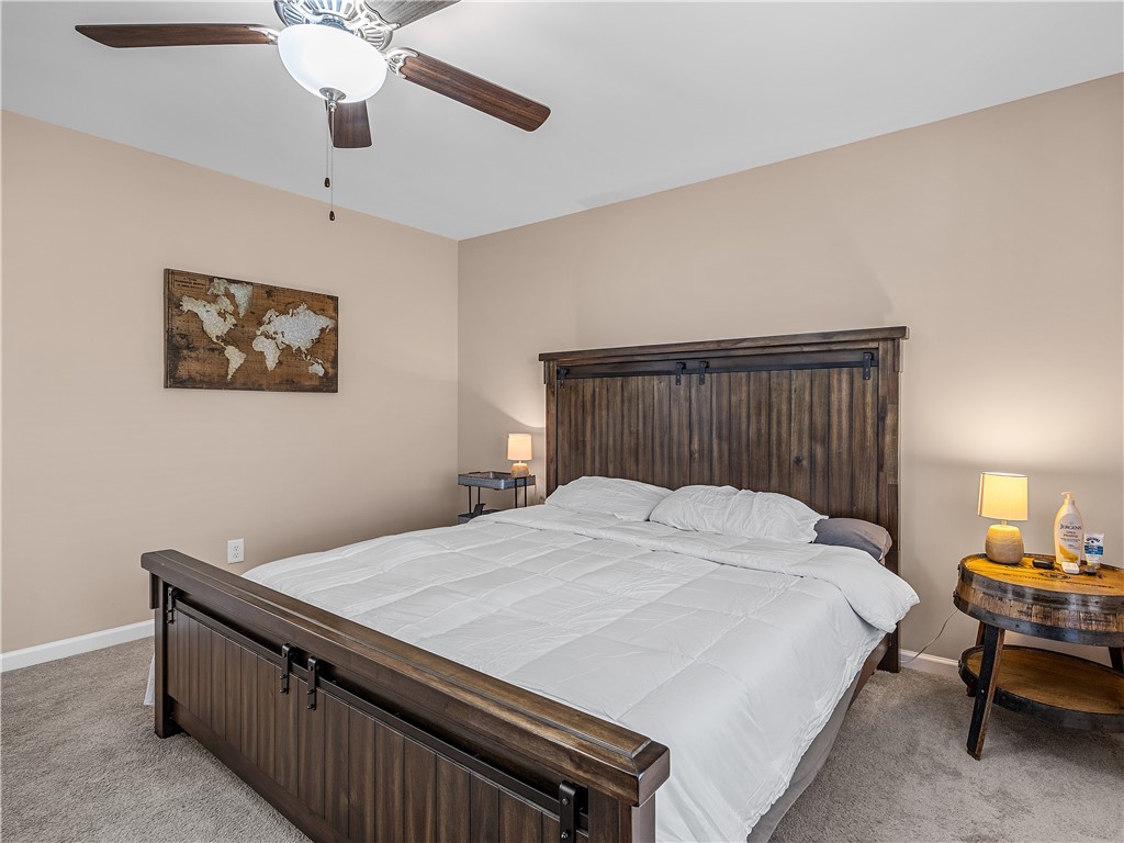 2520 Linmar Circle Anderson, SC 29621 - Photo 24 of 50 Comfortable sleeping space featuring warm lighting and a natural wood bed frame.