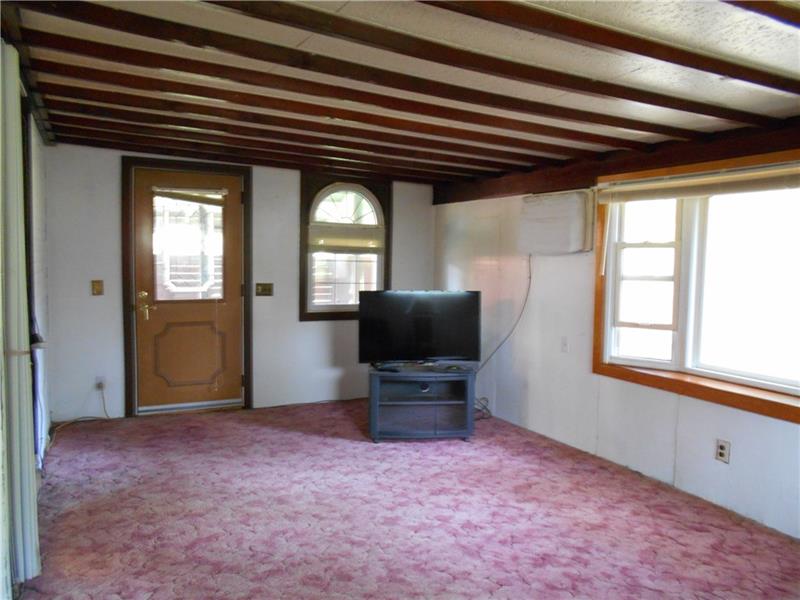 402 Hochberg Road Monroeville, PA 15146 - Photo 12 of 25 Family room with another bay window. Door leads to the side porch.