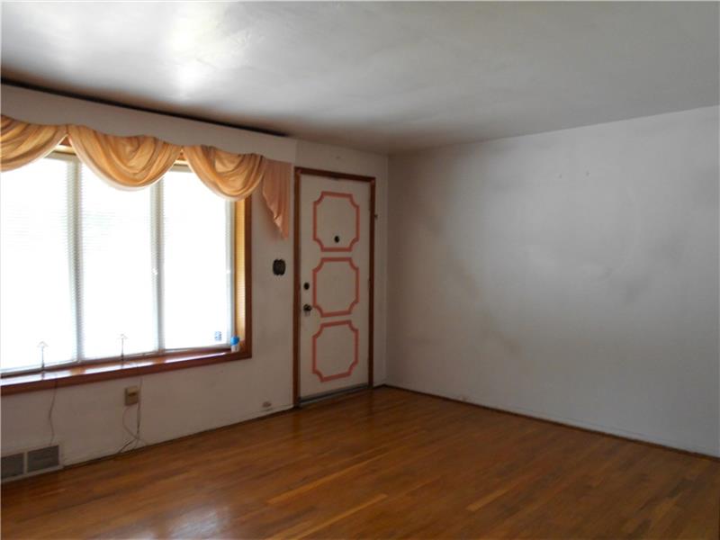 402 Hochberg Road Monroeville, PA 15146 - Photo 8 of 25 Living room with bay window and hardwood floors.