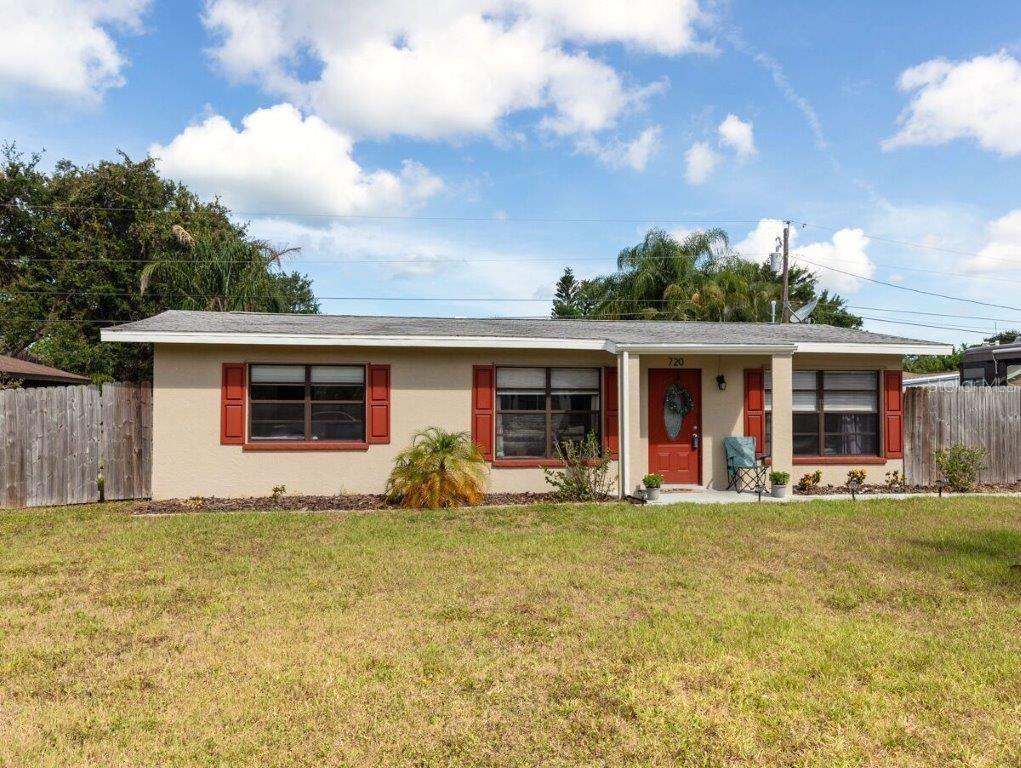 720 Cumberland Road Venice, FL 34293 - Photo 1 of 1 a front view of house with yard and porch