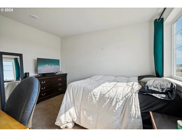 a bedroom with a bed and furniture