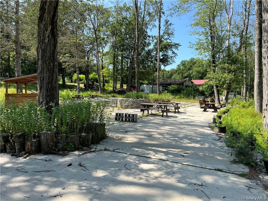 79 Bisch Road Middletown, NY 10940 - Photo 4 of 6 a view of a patio with chairs and a yard