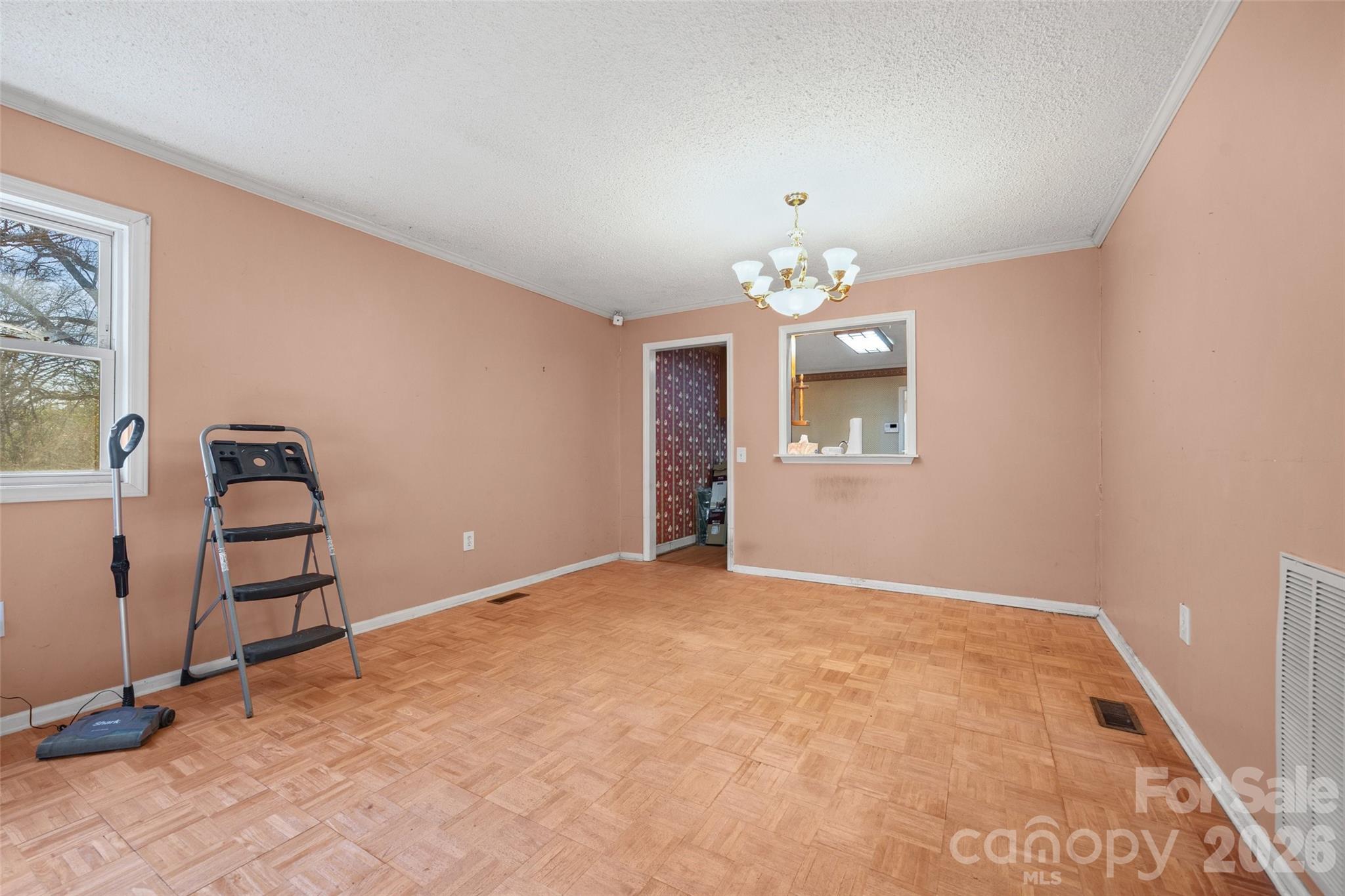 5323 South New Hope Road Belmont, NC 28012 - Photo 13 of 43 an empty room with windows and ceiling fan