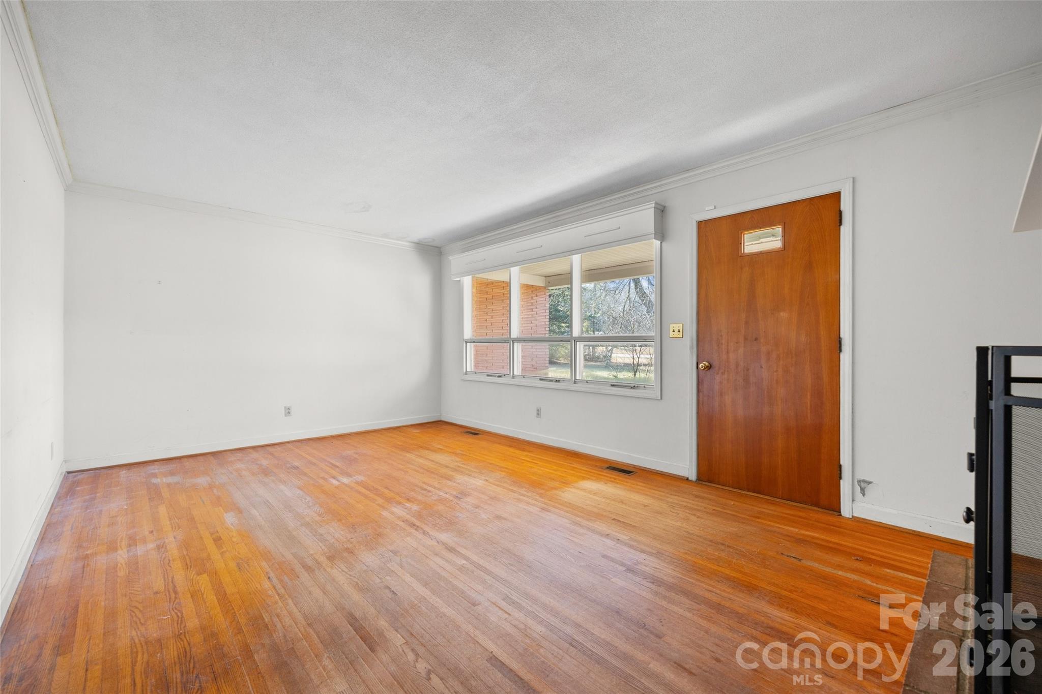 5323 South New Hope Road Belmont, NC 28012 - Photo 16 of 43 a view of empty room with wooden floor and fan