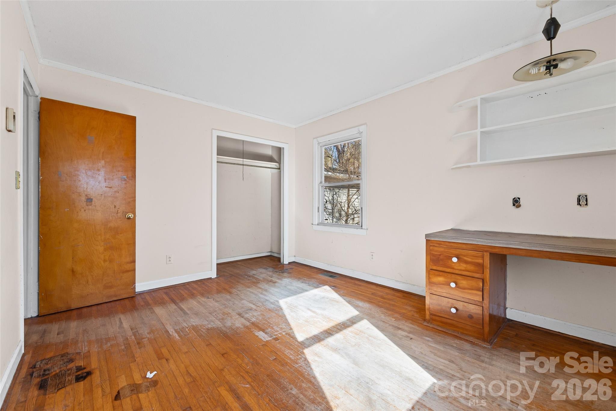 5323 South New Hope Road Belmont, NC 28012 - Photo 21 of 43 a view of an empty room with window and wooden floor