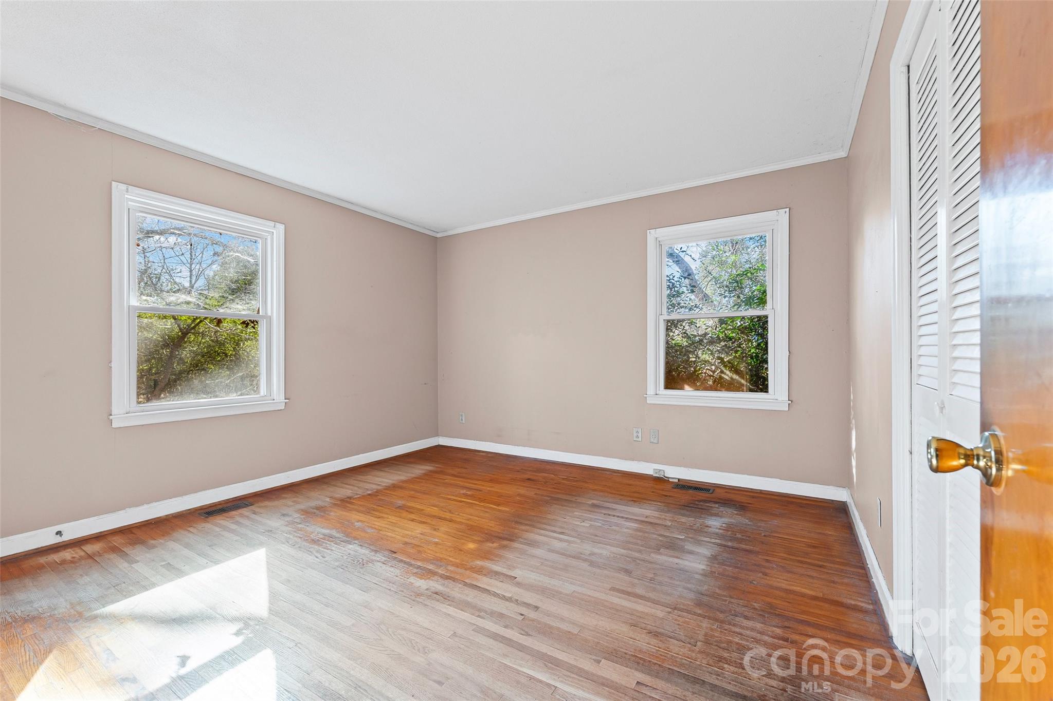 5323 South New Hope Road Belmont, NC 28012 - Photo 24 of 43 a view of an empty room with window and wooden floor