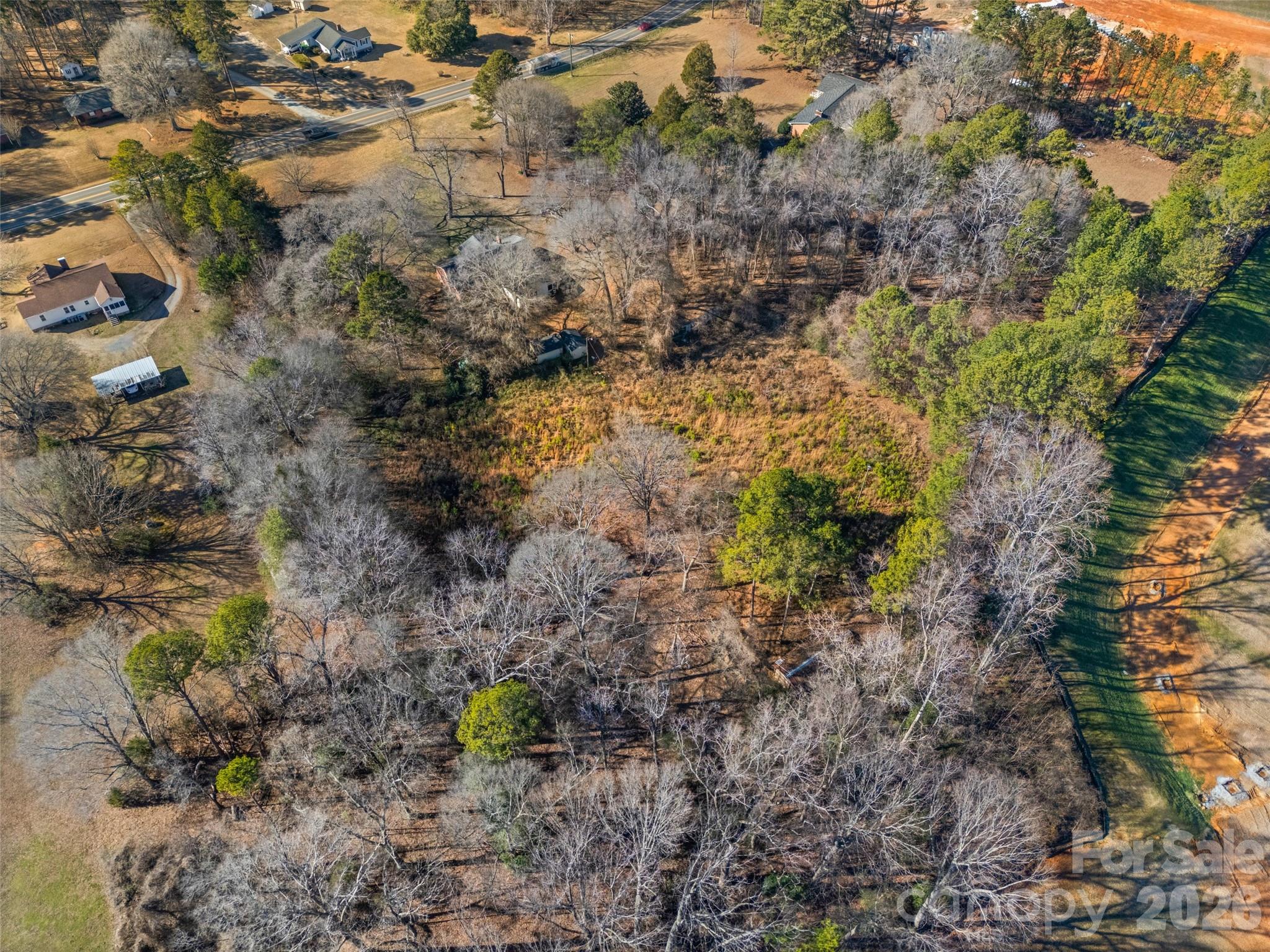 5323 South New Hope Road Belmont, NC 28012 - Photo 37 of 43 a view of a yard with plants and trees
