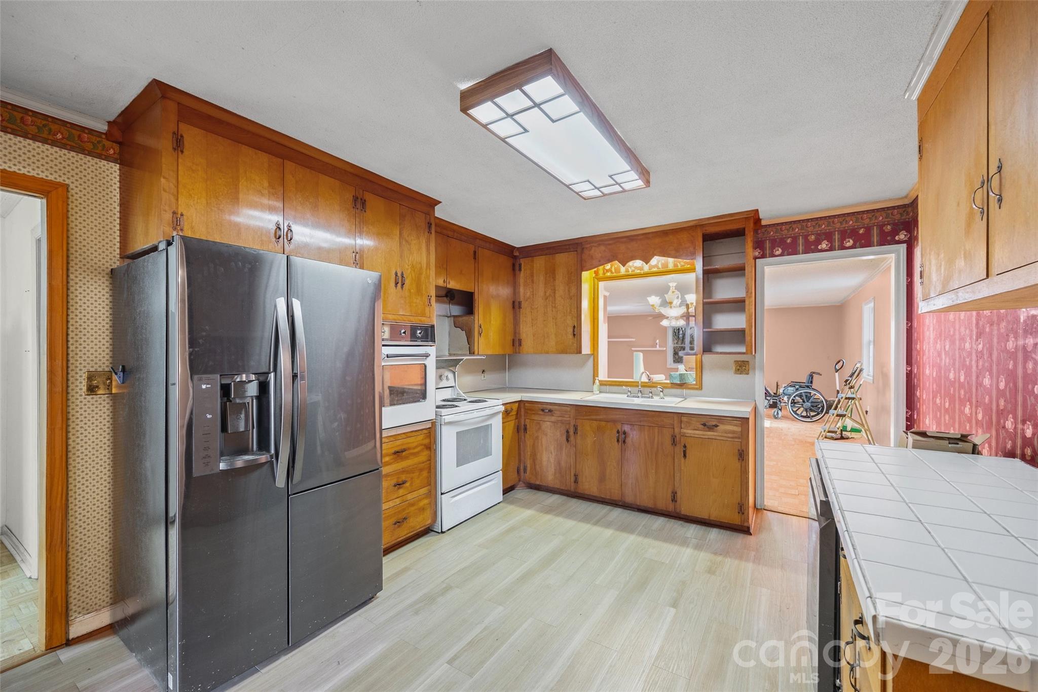5323 South New Hope Road Belmont, NC 28012 - Photo 4 of 43 a kitchen with stainless steel appliances granite countertop a refrigerator a stove and a sink