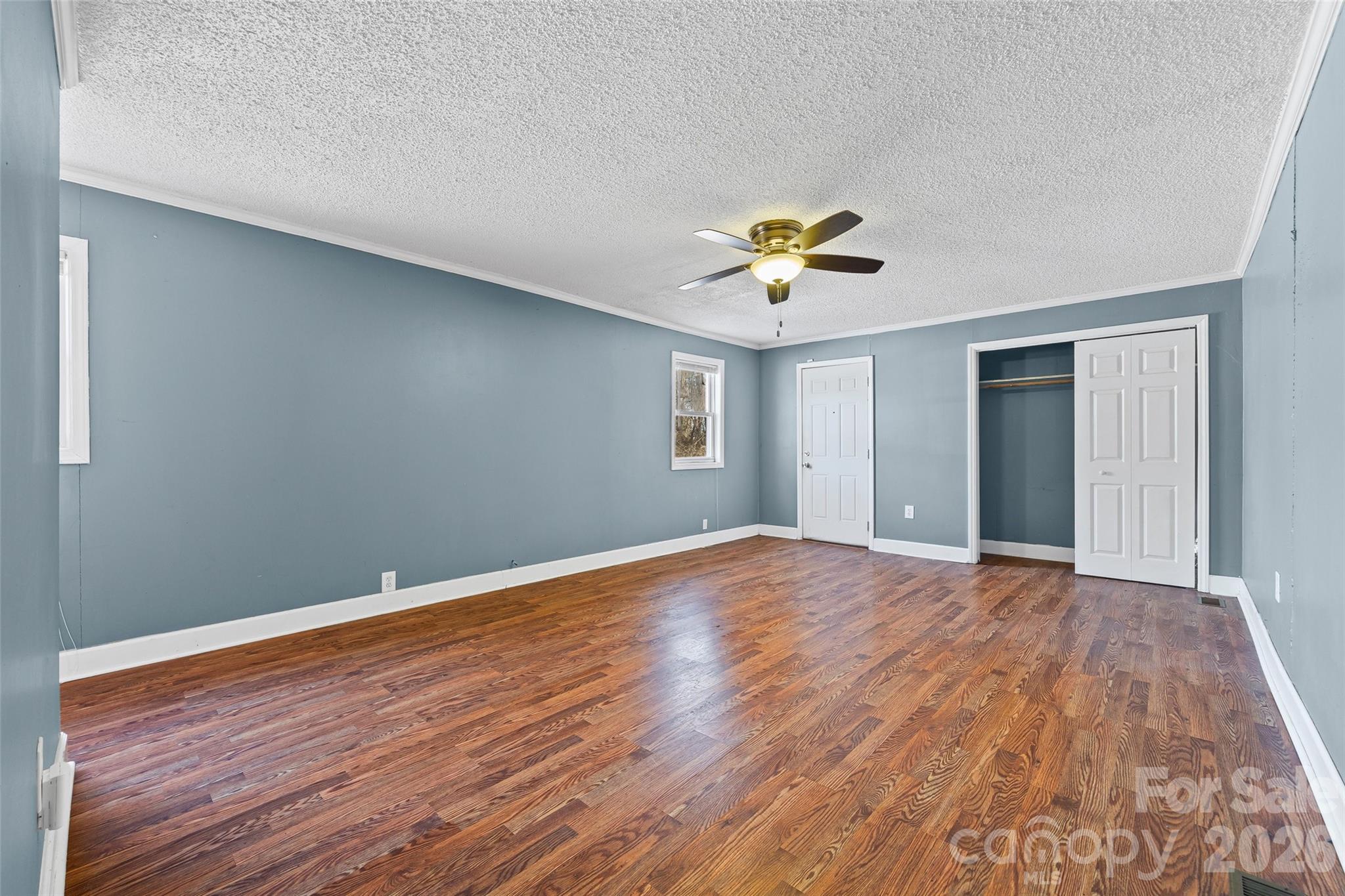 5323 South New Hope Road Belmont, NC 28012 - Photo 7 of 43 a view of an empty room with window and wooden floor