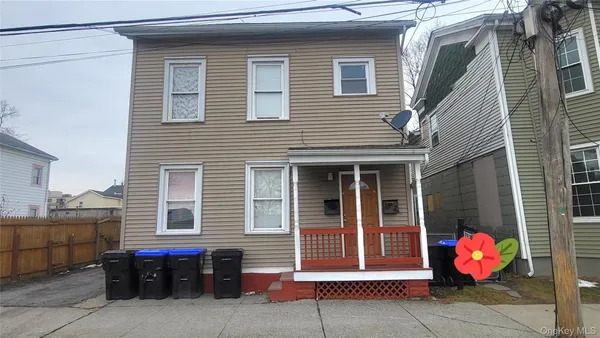 a front view of a house with a garage
